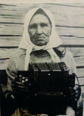 A lady playing a talyanka - early 20thC
