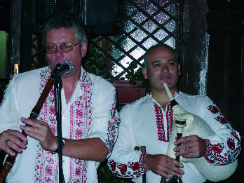 Nicolai Belyavski (left), maker of kaba gaida, together with other players as part of one of the processions