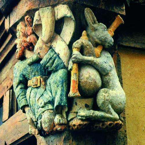 Carving on a building in Malestroit, Brittany, France. From the collection of Bill Reese.